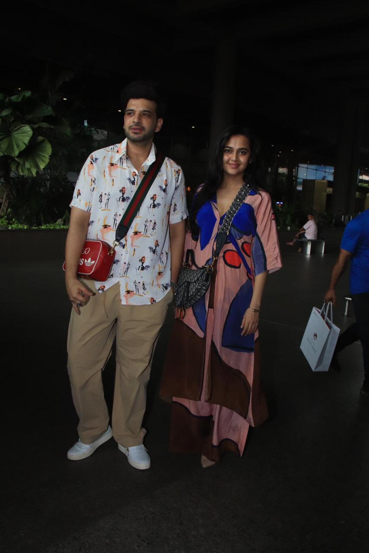 Love birds Karan Kundrra and Tejasswi Prakash returned from their quick vacation. They were seen in casual outfits at the airport